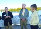 Lt. Governor Smith visits with Mayor Rollin Hall (left) and NEC Executive Director Rolf Thompson on the second story balcony of the Eagle Center, overlooking the Mississippi River. 