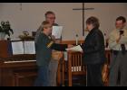 As the name of her late husband, Merlin Mikelson, was read, Janice Mikelson smiled as she accepted her Christmas ornament to keep in memory of him.