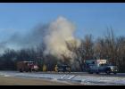 This was the scene as emergency vehicles arrived to the crash site on Highway 61 just south of Highway 60 last Wednesday morning as smoke pours from the burning car, not visible, that had careened off the roadway and traveled down the embankment. The driver, Gayle Grippen of Wabasha, was rescued from the burning car by Wabasha police sergeant Randy Wagoner.—Photos by Michael Smith