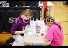 Olivia and Madison have fun coloring at the St. Charles Childcare booth during the expo on Saturday afternoon. Photo by St. Charles Press Editor Laura Berndt. 