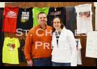 Melia Haugen and Tim Ahrens  represented Cotton Chemistry custom apparel, of Altura, at the expo. Photo by St. Charles Press Editor Laura Berndt. 