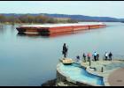 A small crowd at the City Fountain joined Chief Wapahasha II in watching the first barge of the 2016 shipping season pass Wabasha this past Saturday. It went by at approximately 3:45 p.m. after locking through at Alma shortly before 2 p.m. The Motor Vessel Ronald Wagonblast was pushing 12 empty barges for St. Paul. She was followed shortly afterward by the Jonathan Erickson, also pushing 12 empties. According to Lockmaster Gordon Holman at Alma Lock & Dam 4, as of Monday morning, there had already been eigh