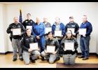 Above, from left to right in the front row, are EMT Peter Pillman, Officer Amanda Schwennsen, and Deputy Jennifer Niehoff. In the second row are Officer Jeff Krisik, Durand Police Sergeant Sam Miller, citizen Ronald Asher, Officer Don Sinz, Durand Ambulance Service member Larry Tearman, Durand Ambulance Service member Ryan Anderson, and Durand Firefighter driver Ron Jasperson. Laura Berndt photo