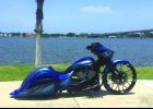 The custom-made Victory motorcycle sits near the shore in Daytona Beach just outside Peter’s workplace, the Indian Motorcycle dealership. 
